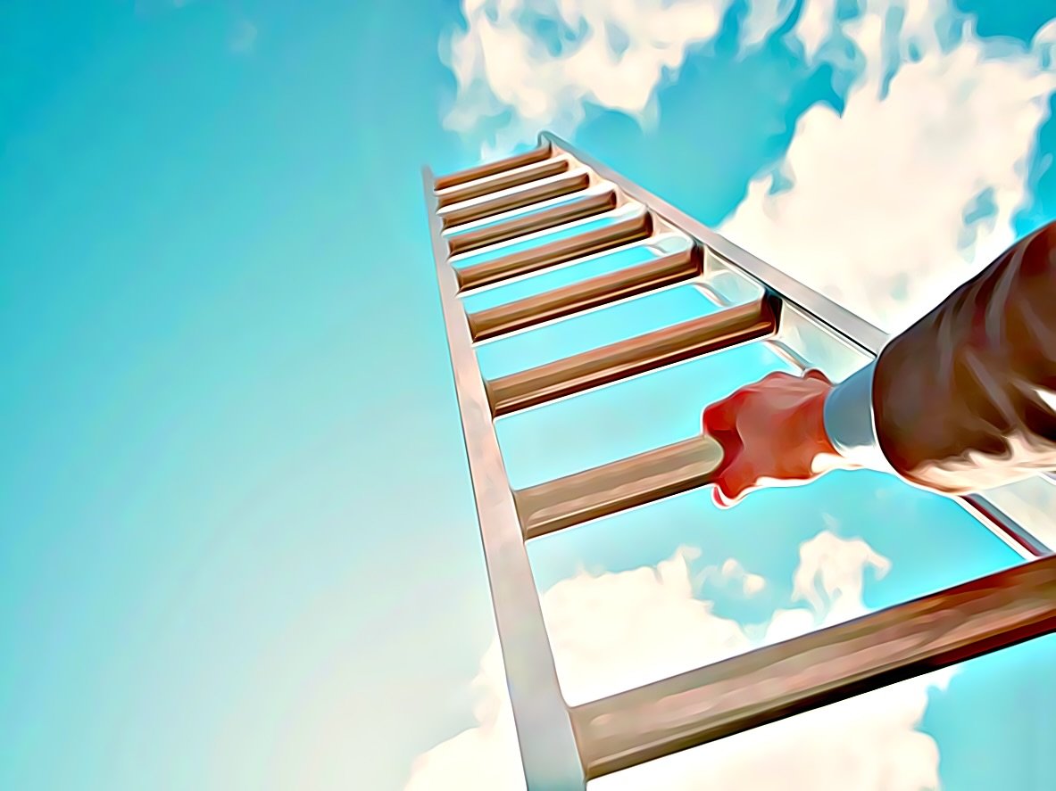 A business person's hand, climbing a ladder.