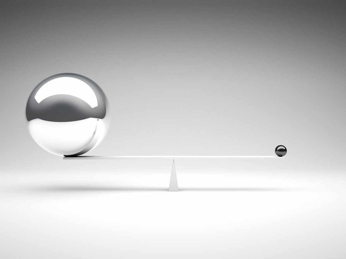 image of large silver ball vs small black ball symbolizes our belief to be big