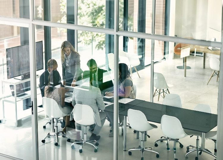 Team meeting at 1697 Dynamics office, collaborating on building client strategies.